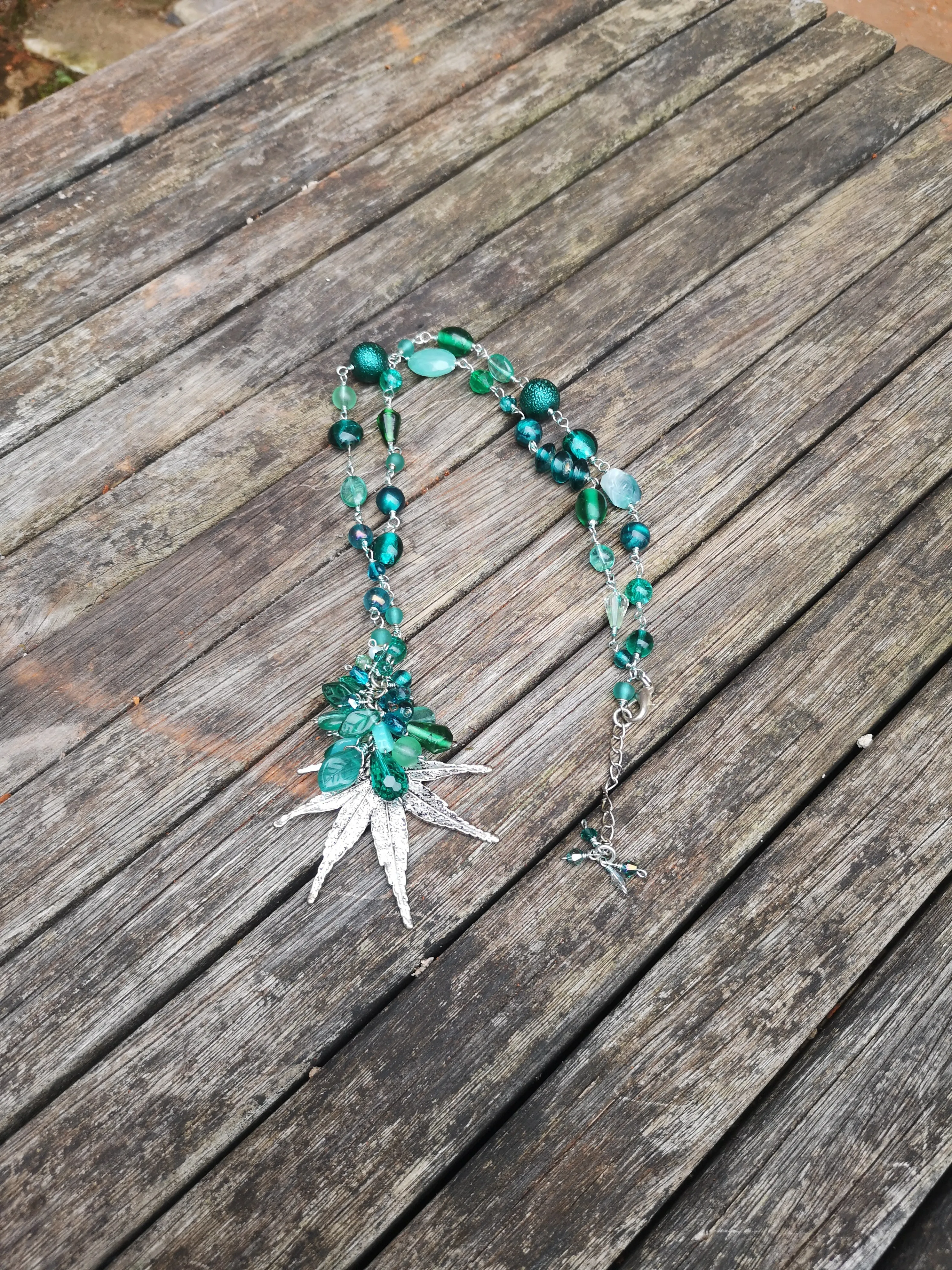 "Hemp", long line beaded necklace, with silver plated flat leaf design,