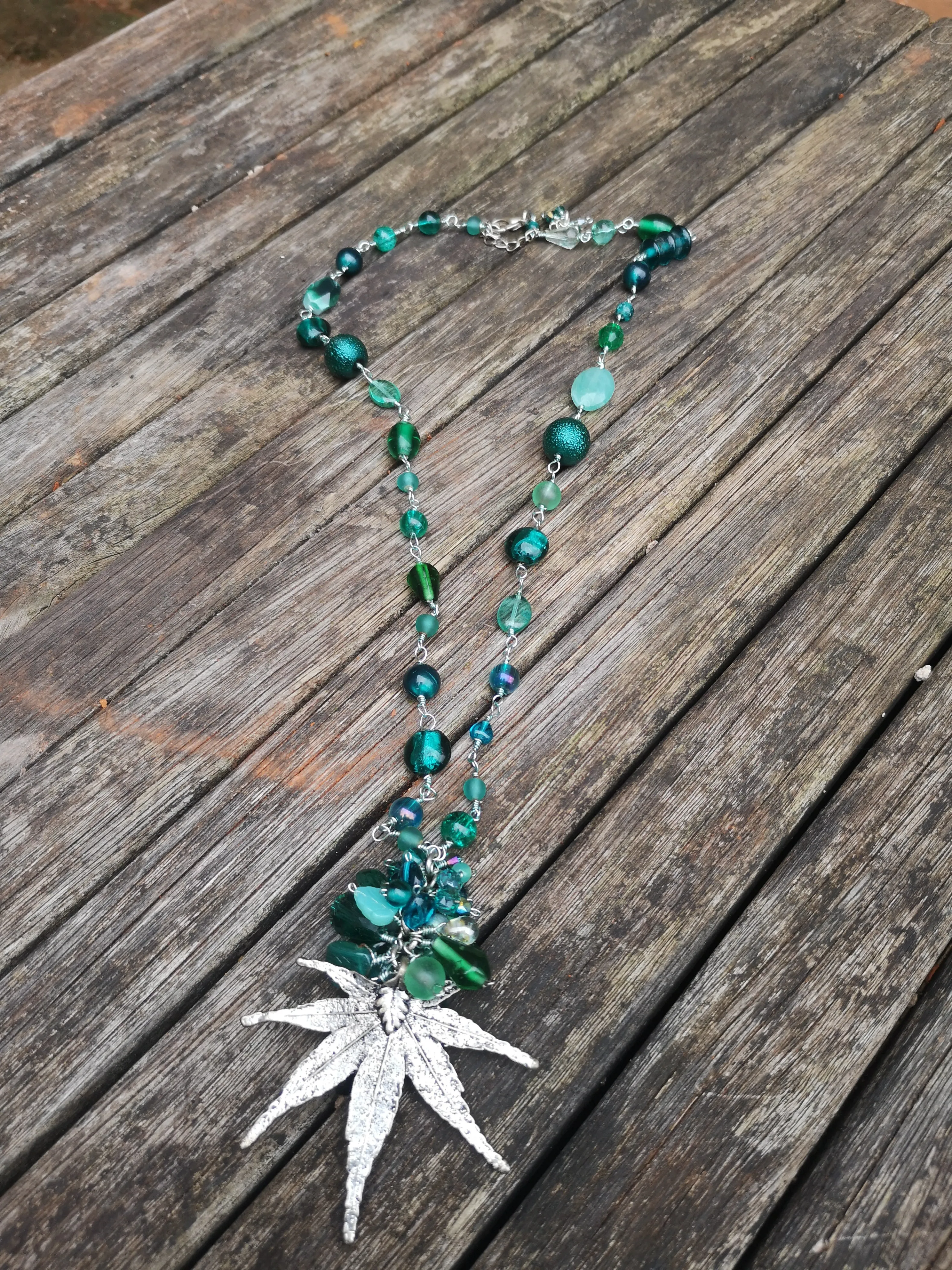 "Hemp", long line beaded necklace, with silver plated flat leaf design,